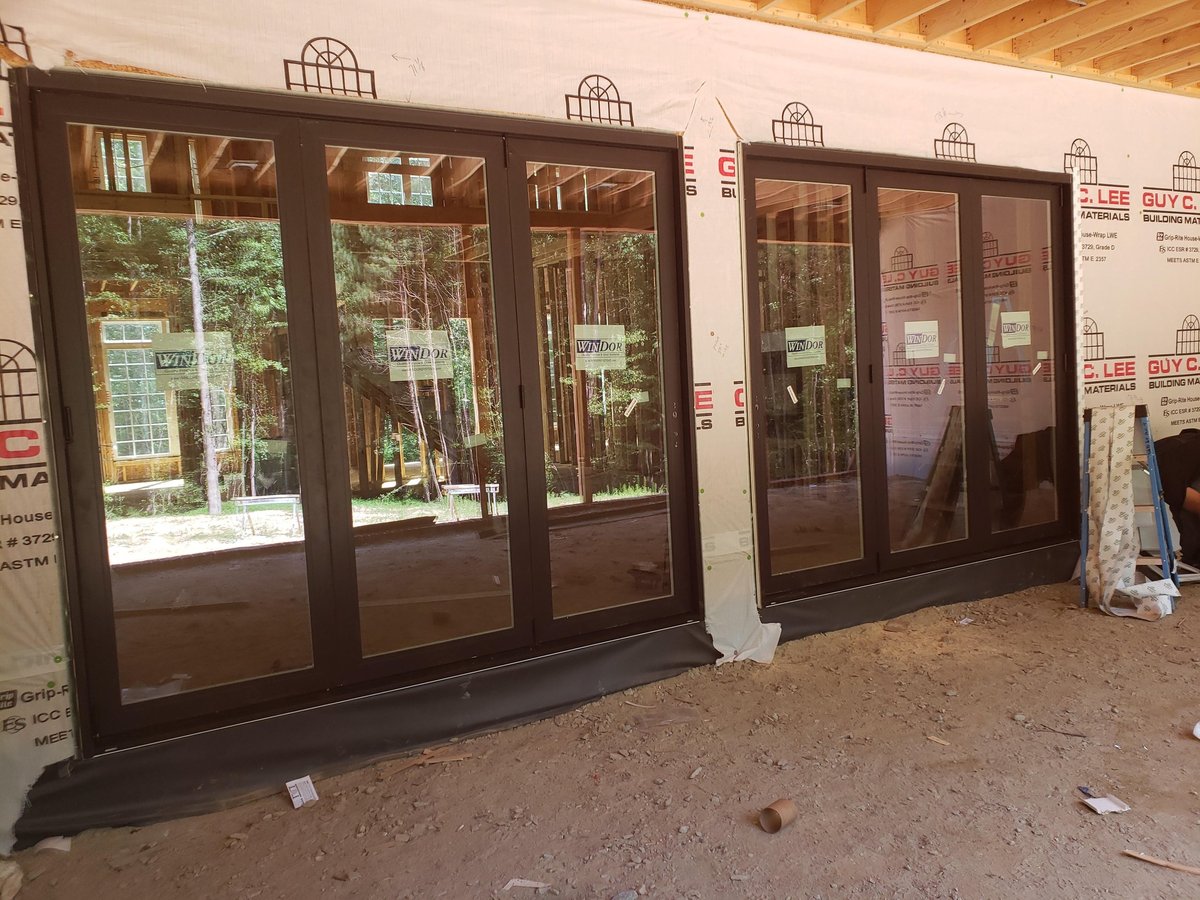 Dark brown glass doors and windows on display before installation